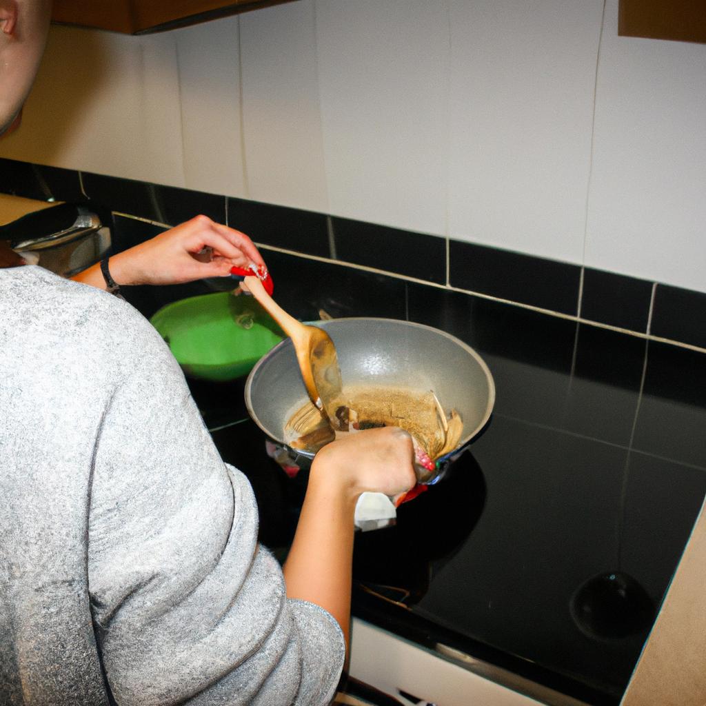 Person cooking in a kitchen