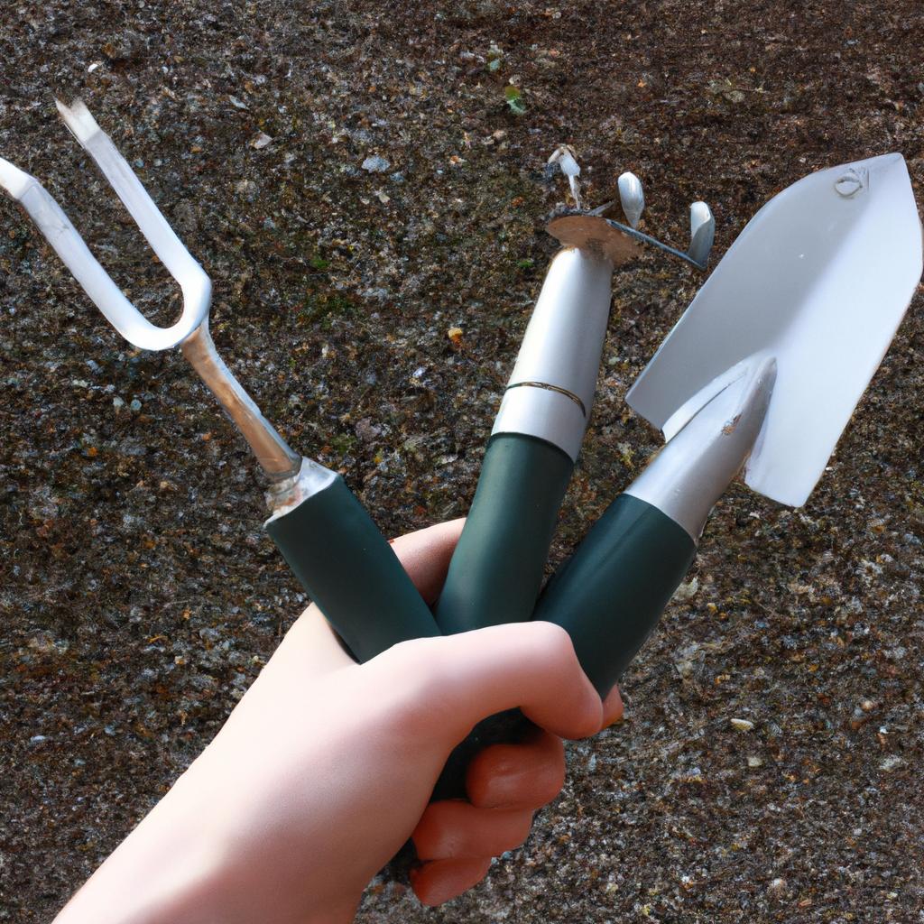 Person holding gardening tools, planting